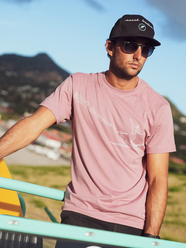 T-shirt with a print of a girl surfing on a plane in Saint Barths